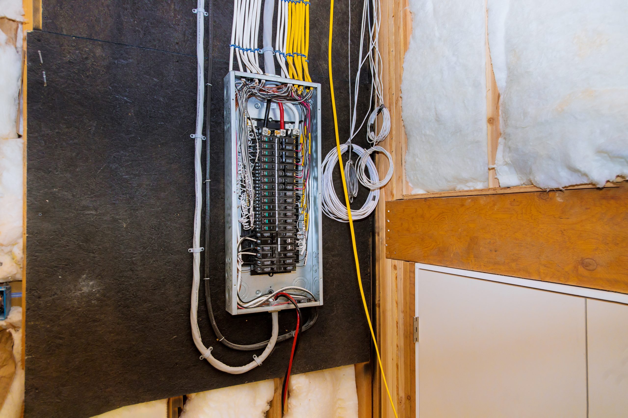 Switchboard electrical voltage box with wires with circuit breakers.
